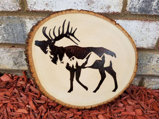 Elk silhouette with mountain scene