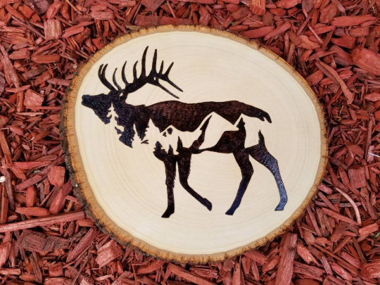 Elk silhouette with mountain scene